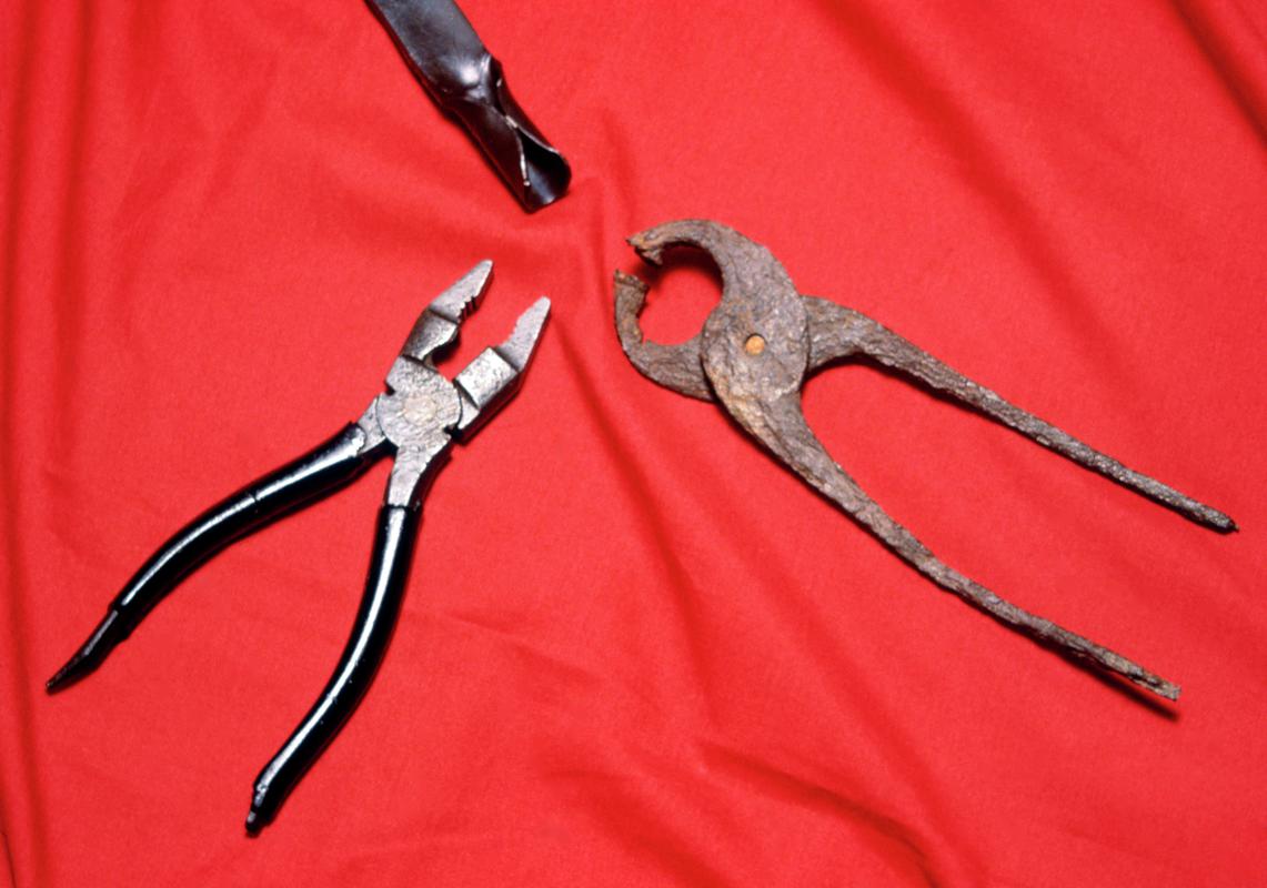 Iron tongs and currency bar with modern pliers