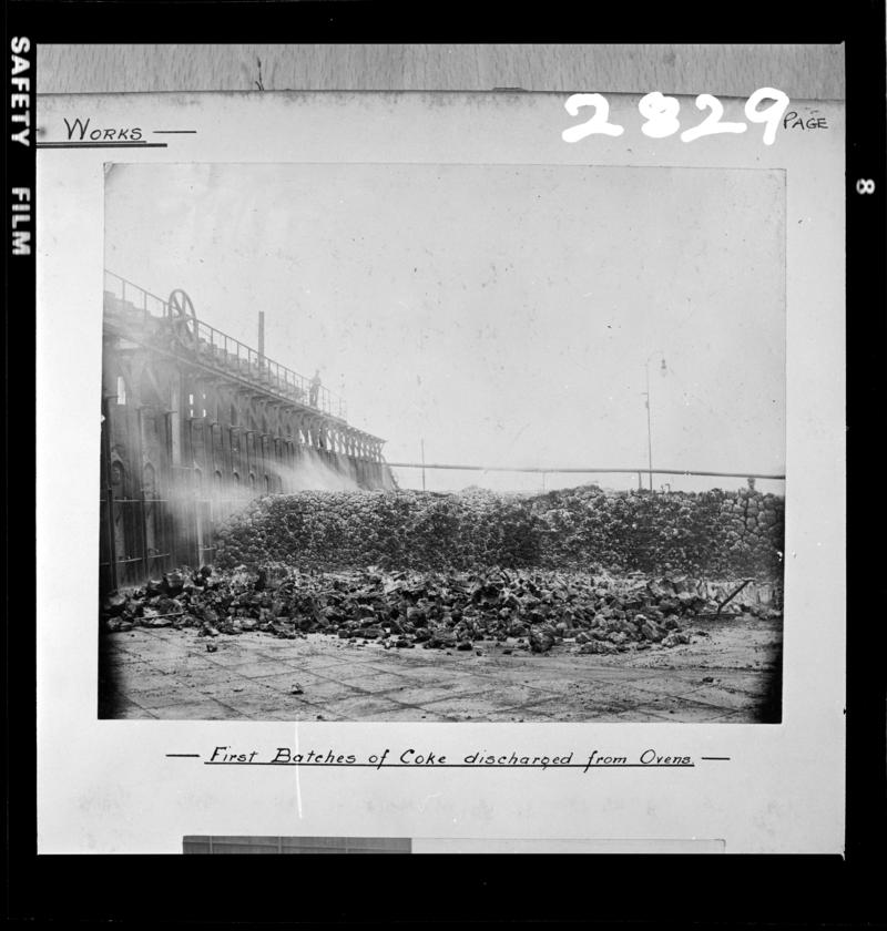Black and white film negative of a photograph showing the &#039;First Batches of Coke Discharged from Ovens&#039; at the new Maritime Coke Ovens, 1903.