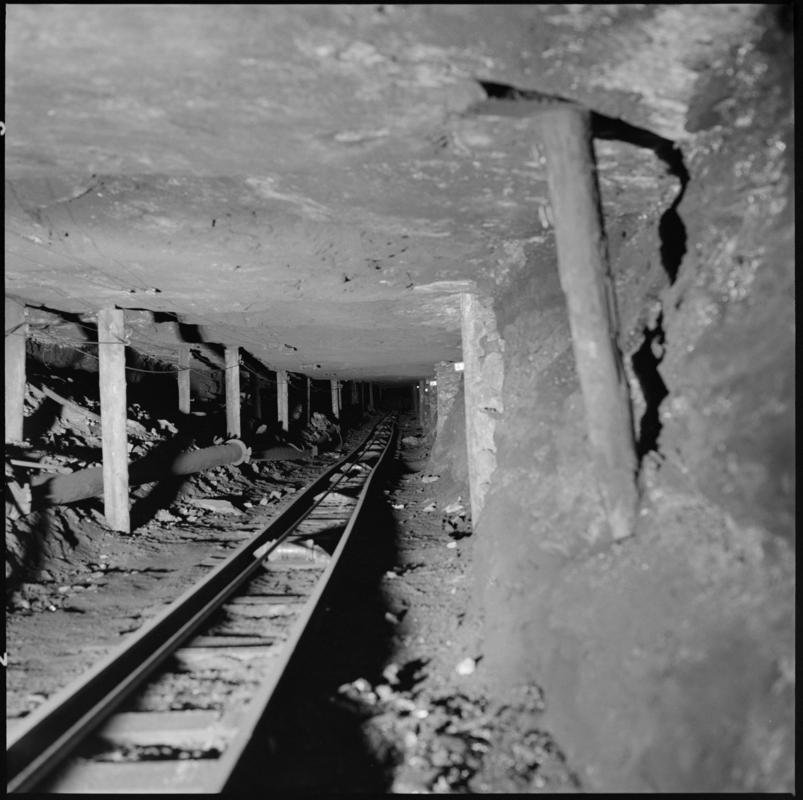Black and white film negative showing an underground roadway, Morlais Colliery.