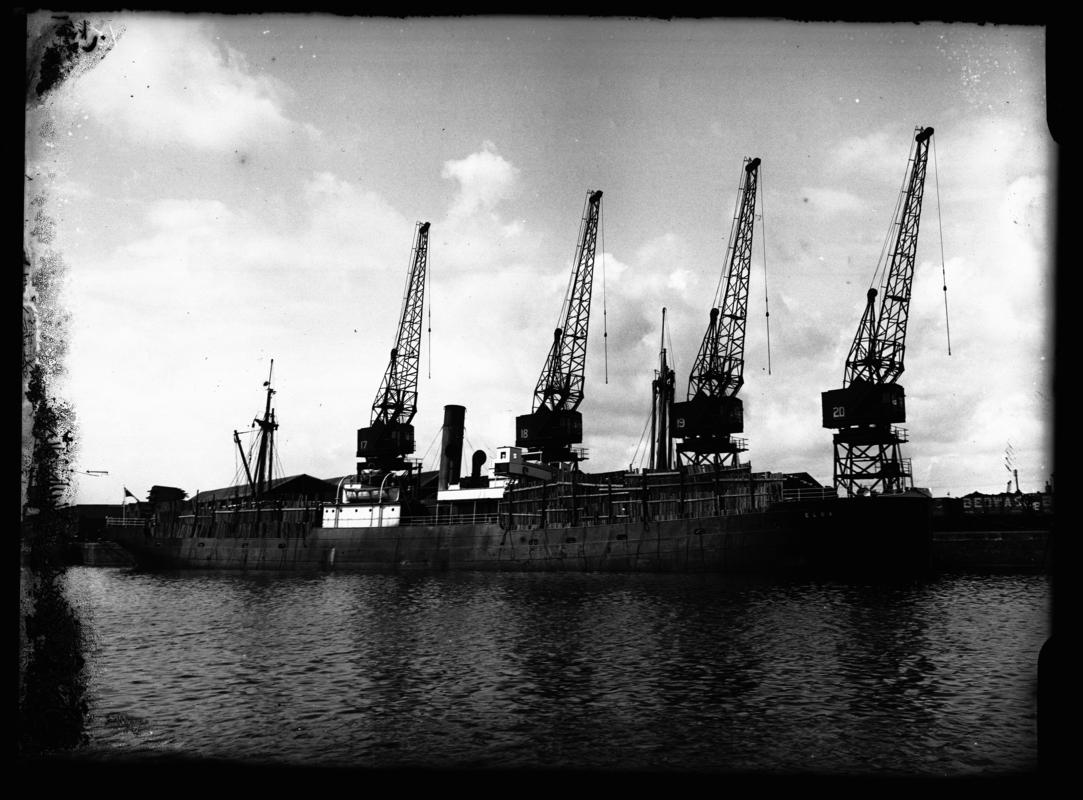 Port broadside view of S.S. ELBA and deck cargo pit props at Cardiff Docks, c.1936.