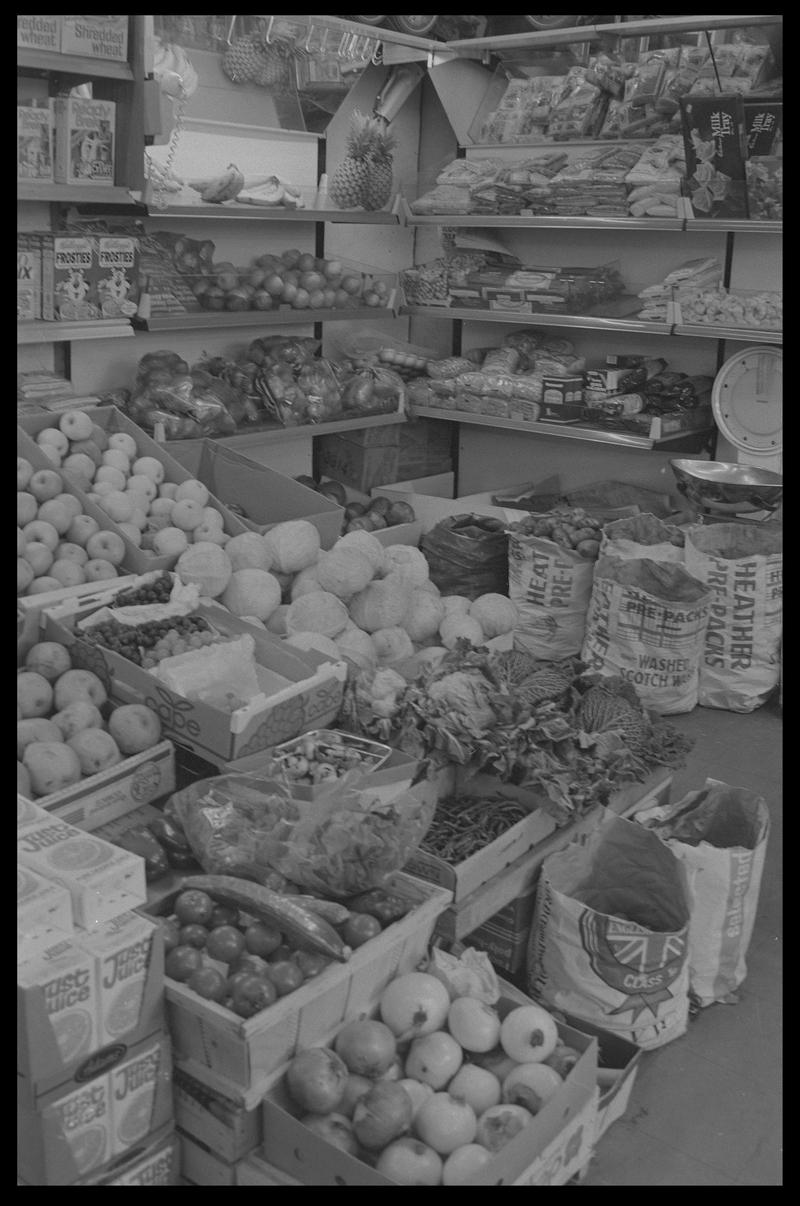 Boxes of fruit and vegetables in supermarket, Loudoun Square, Butetown.