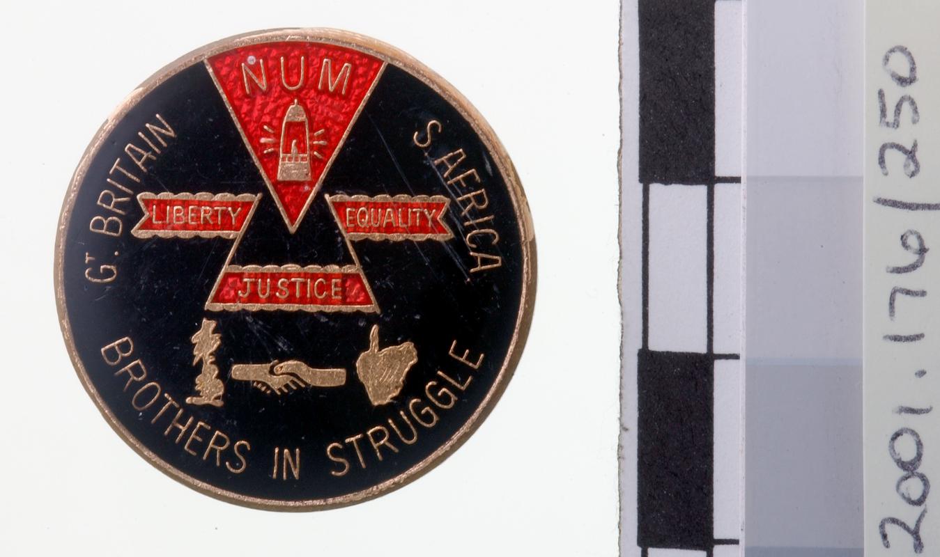 N.U.M. support group, badge