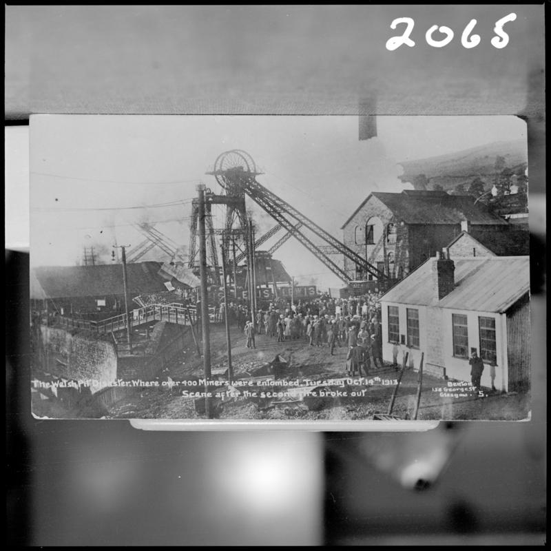 Black and white film negative of a photograph showing the scene at Universal Colliery, Senghenydd after the explosion of 14 October 1913.  Caption on photograph reads &#039;the Welsh pit disaster where over 400 miners were entombed.  Tuesday Oct 14th 1913.  Scene after the second explosion&#039;.  &#039;Senghenydd Disaster 1913&#039; is transcribed from original negative bag.