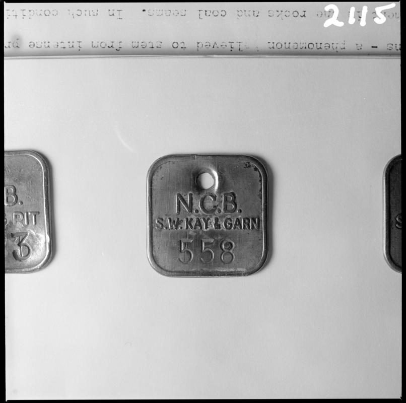 Black and white film negative showing a Blaenavon Co. Ltd. Garn and Kay&#039;s Slope lamp check, no.558.  &#039;Blaenavon check Garn and Kays&#039; is transcribed from original negative bag.