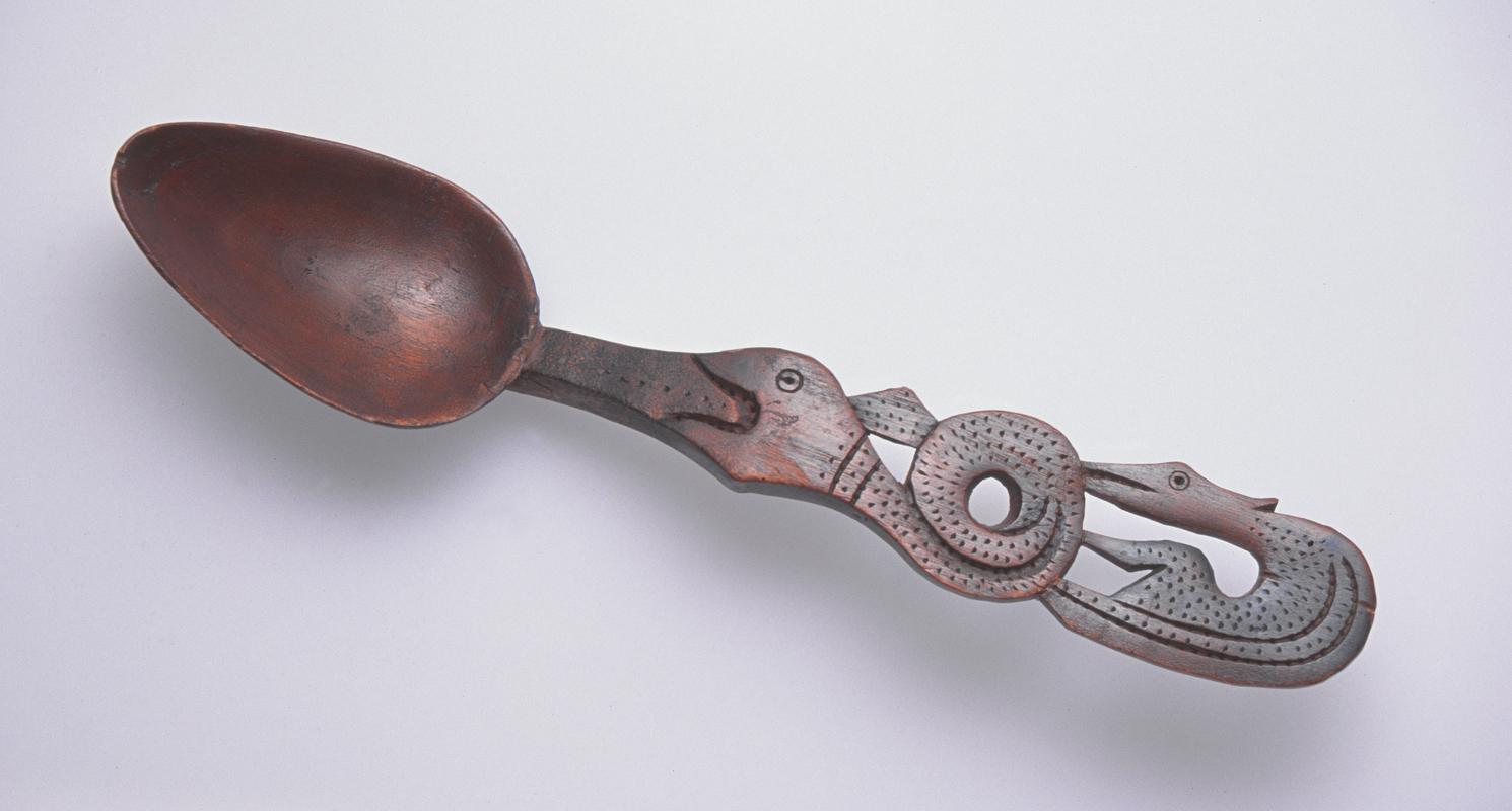 Lovespoon with handle carved to depict serpent and bird