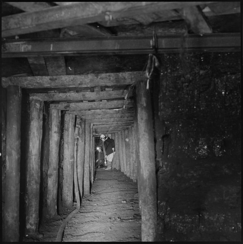 Black and white film negative showing two men at a timbered longwall face, Big Pit Colliery.  &#039;Big Pit&#039; is transcribed from original negative bag.