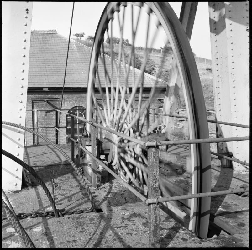 Black and white film negative showing the wheel of the headgear, Tirpentwys Colliery.