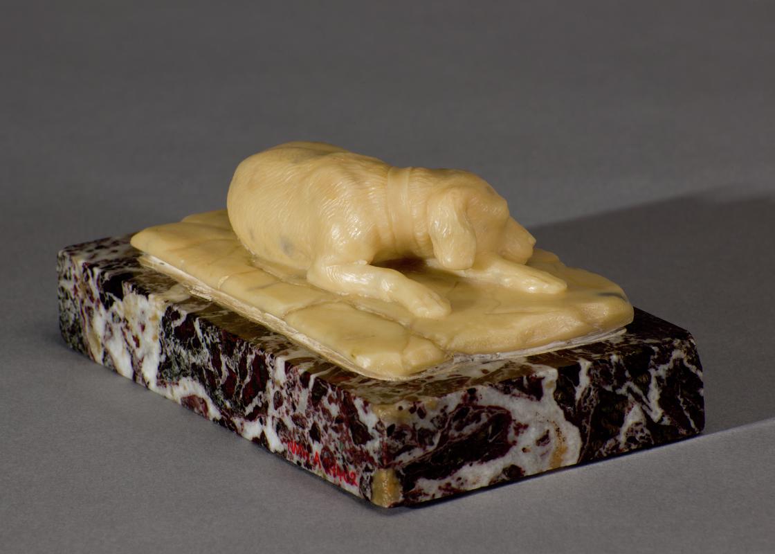 Small sculpture of a sleeping hound
