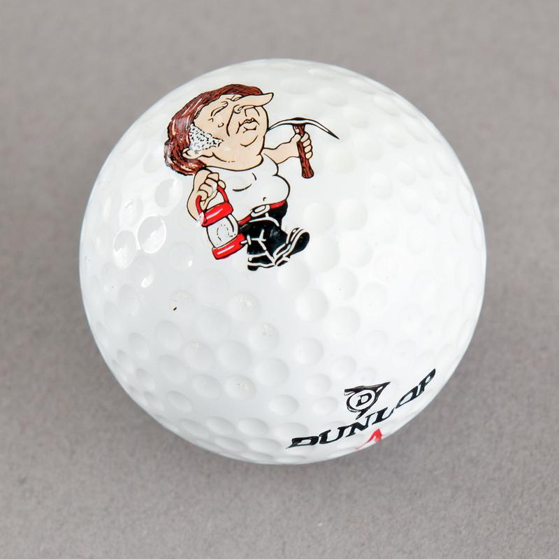 Golf ball with caricature of Arthur Scargill. Sold during 1984-85 Miners&#039; Strike.