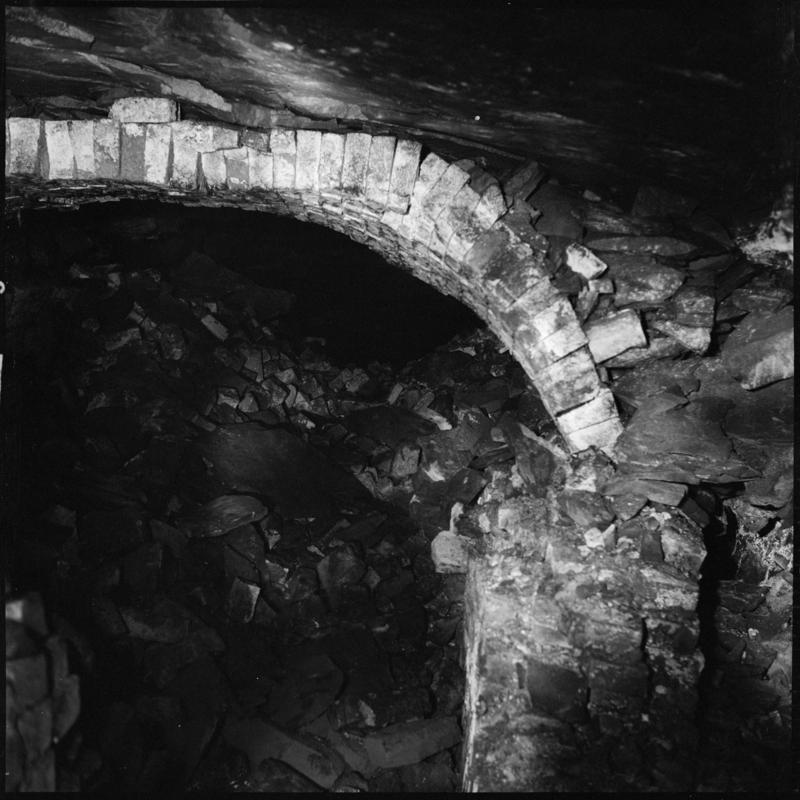Black and white film negative showing the remains of the ventilation furnace at Tymawr Colliery.  The furnace was situated on the No. 3 landing in the Hetty shaft.  &#039;Hetty furnace&#039; is transcribed from original negative bag.