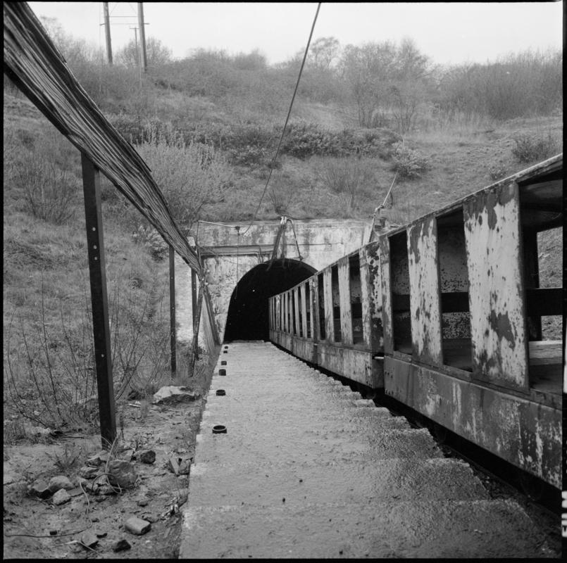 Black and white film negative showing the manriding train at the entrance of the mine, Cwmgwili Colliery.  &#039;Cwmgwili&#039; is transcribed from original negative bag.