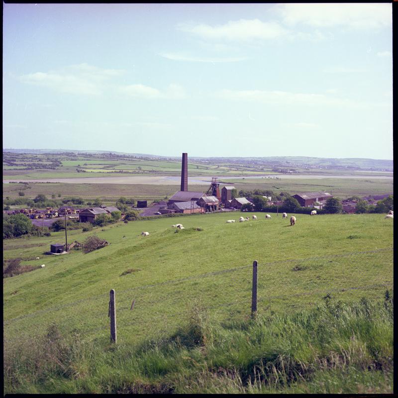 Colour film negative showing a distant surface view of Morlais Colliery. &#039;Morlais&#039; is transcribed from original negative bag.