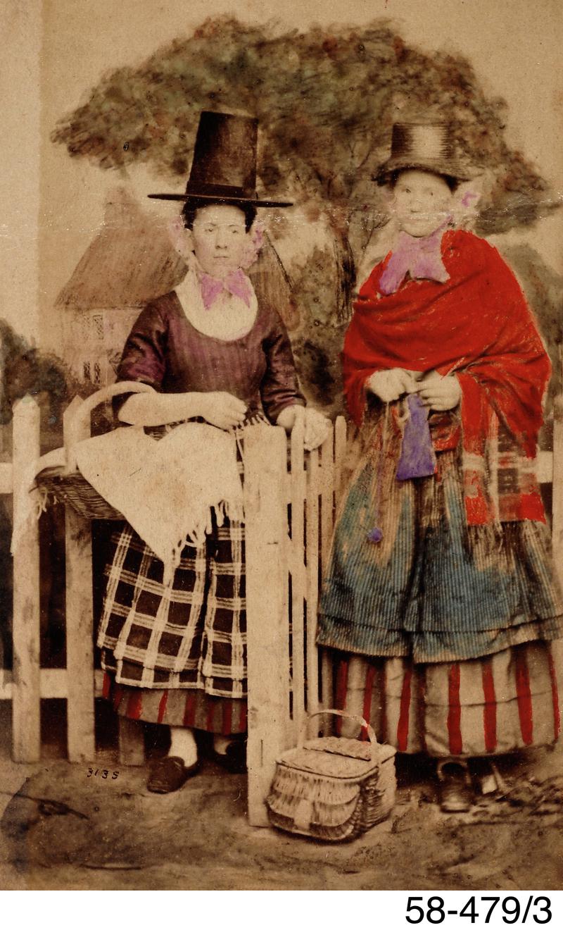 Tinted photograph of two women in Welsh costume