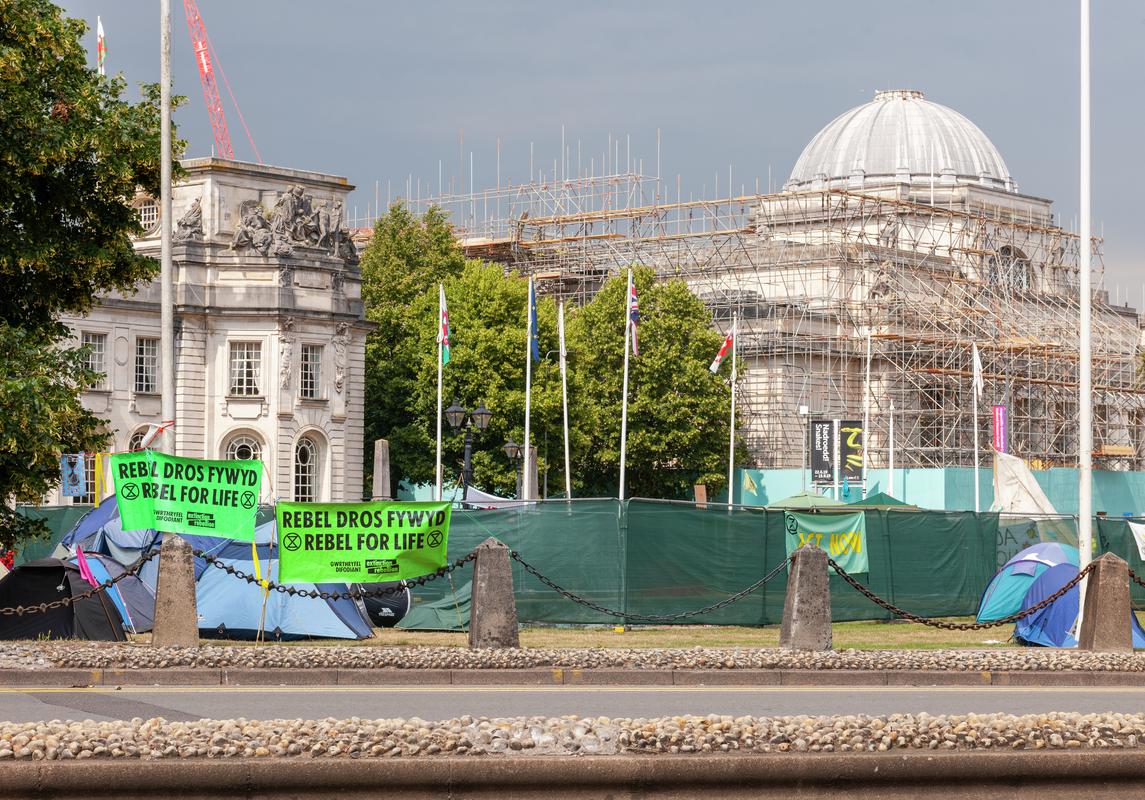 Extinction Rebellion Protest in Cardiff - Civic Centre, Museum and City Hall Lawn. Green Yachts with Protest Slogans, Protest camp and Extinction Rebellion information centre.