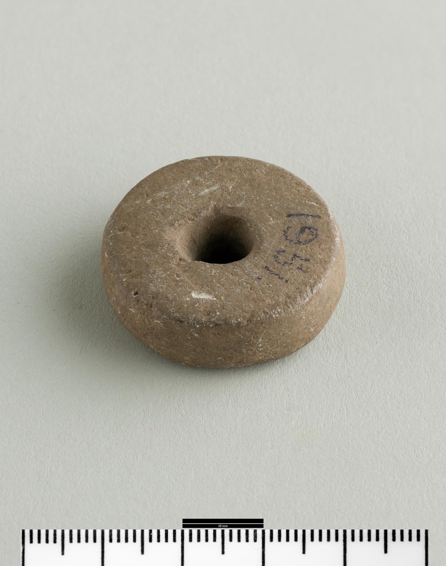 Iron Age / Roman stone spindle whorl