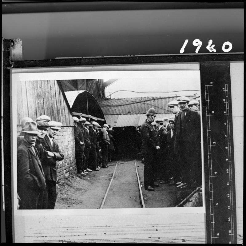 Black and white film negative of a photograph showing miners on the surface, Milfraen Colliery, Blaenavon.  &#039;Milfraen&#039; is transcribed from original negative bag.