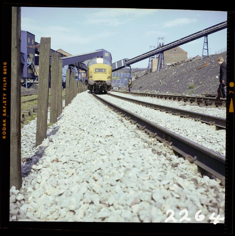 Colour film negative showing a locomotive passing through Oakdale Colliery, 16 April 1981.  &#039;Oakdale 16/4/81&#039; is transcribed from original negative bag.