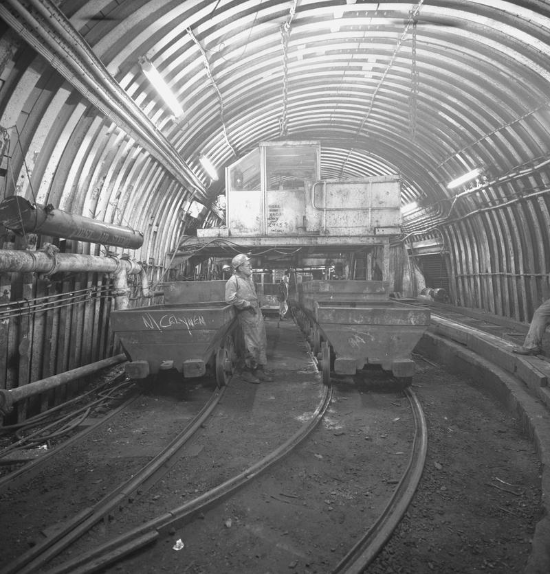 Black and white film negative showing men and drams at pit bottom, Oakdale Colliery, May 1980.  &#039;Oakdale May 1980&#039; is transcribed from original negative bag.