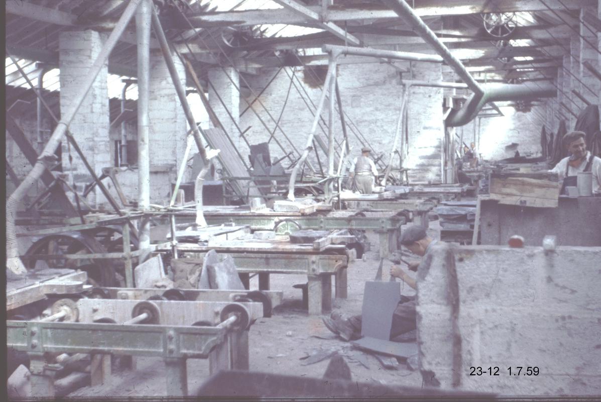 General view of a saw shed at Penrhyn Quarry. Dust extraction systems can be seen above the saw tables.
