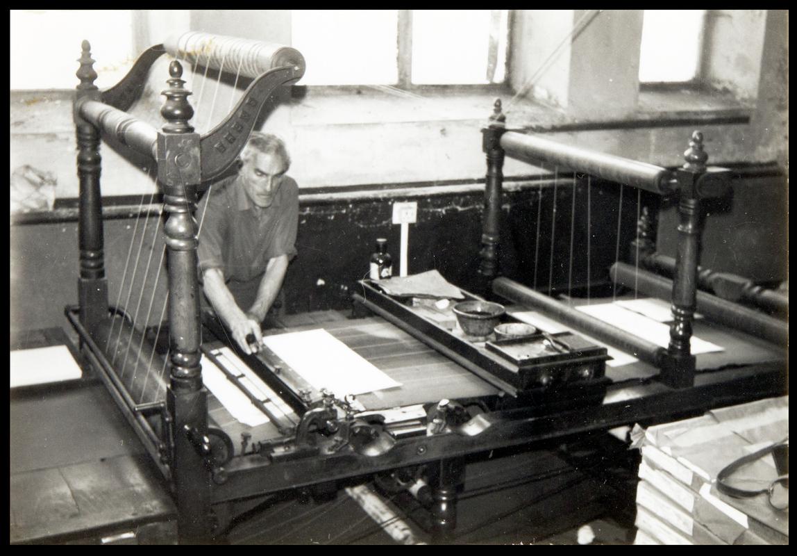 Ruling machine in use at R.E. Jones &amp; Bros. Ltd.