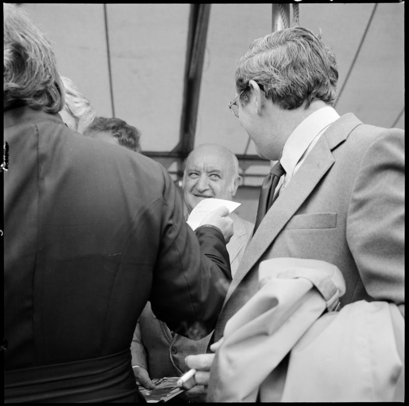 Black and white film negative showing the unveiling ceremony of the Senghenydd memorial, commemorating the 1913 Universal Colliery explosion.  The negative is undated but the ceremony took place in October 1981. &#039;Senghenydd&#039; is transcribed from original negative bag.