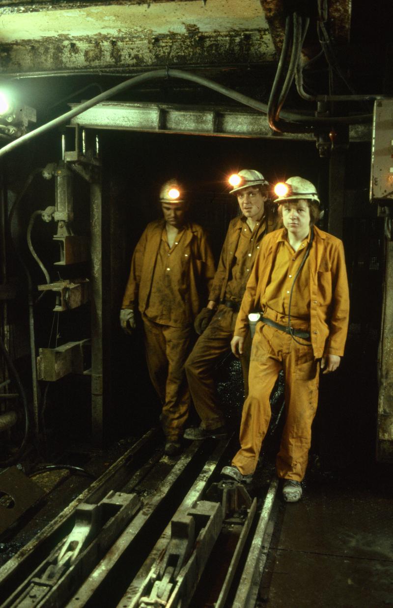 Colour film slide showing three miners at pit bottom, Oakdale Colliery 21 May 1981.