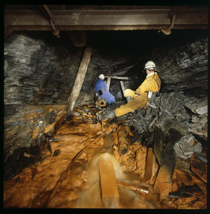 Two men underground at some old workings, Lewis Merthyr Colliery