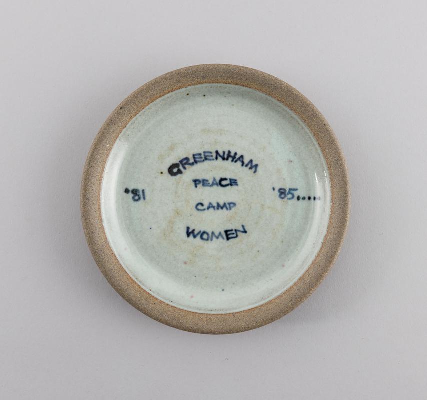 Plate produced and sold by Will and Clare Marno, of Towy Pottery, Rhandirmwyn, to raise funds in support of Greenham Common Women&#039;s Peace Camp.