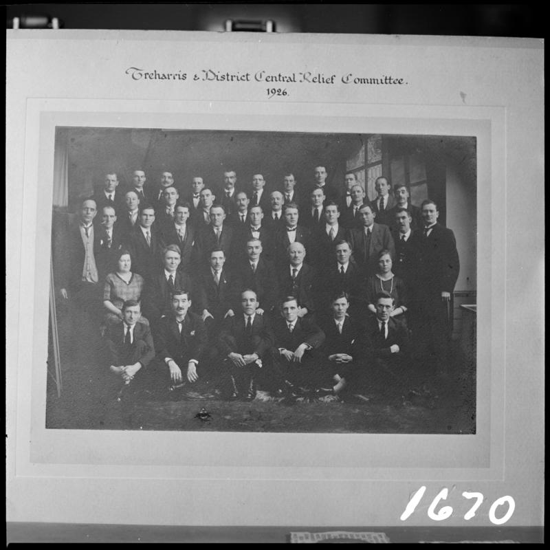 Black and white film negative showing a photograph of Treharris &amp; District Central Relief Committee, 1926.