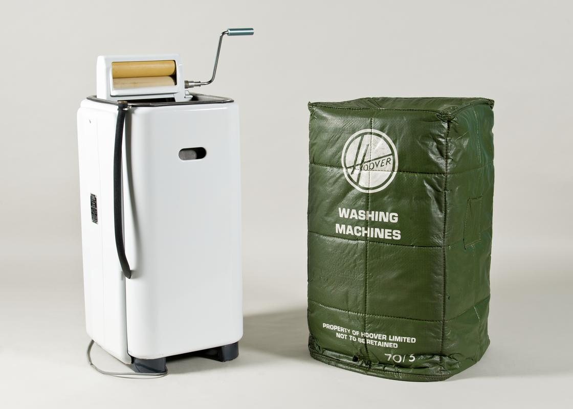 Hoover electric washing machine (2008.1/1) with integral wringer/mangle that folds inside. With &#039;Protectomuffs&#039; cover (2008.1/2) for Hoover washing machine . Green with white lining. Inscription printed in white on one side.