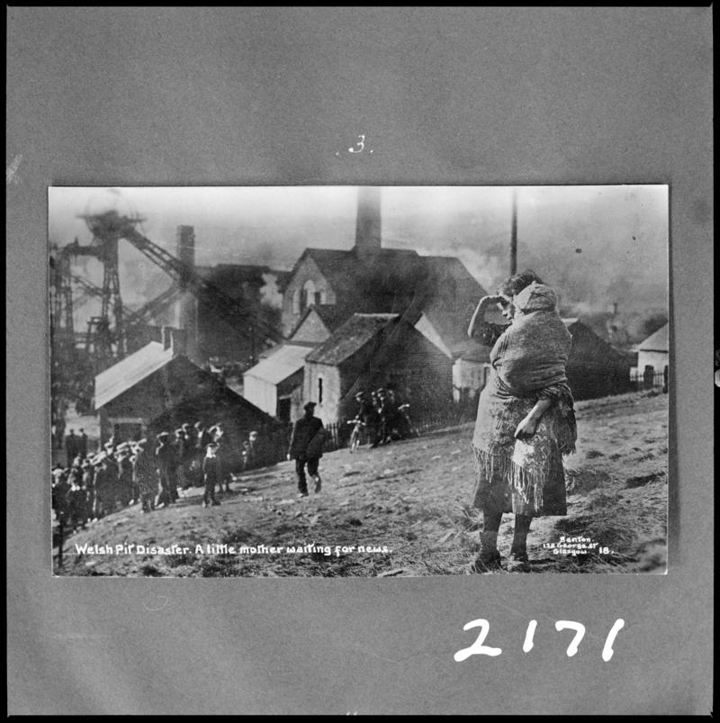 Black and white film negative of a photograph showing the scene at Universal Colliery, Senghenydd following the disaster of 14 October 1913. Caption on photograph reads &#039;Welsh pit disaster.  A little mother waitingfor news&#039;.  &#039;Sen 1913&#039; is transcribed from original negative bag.