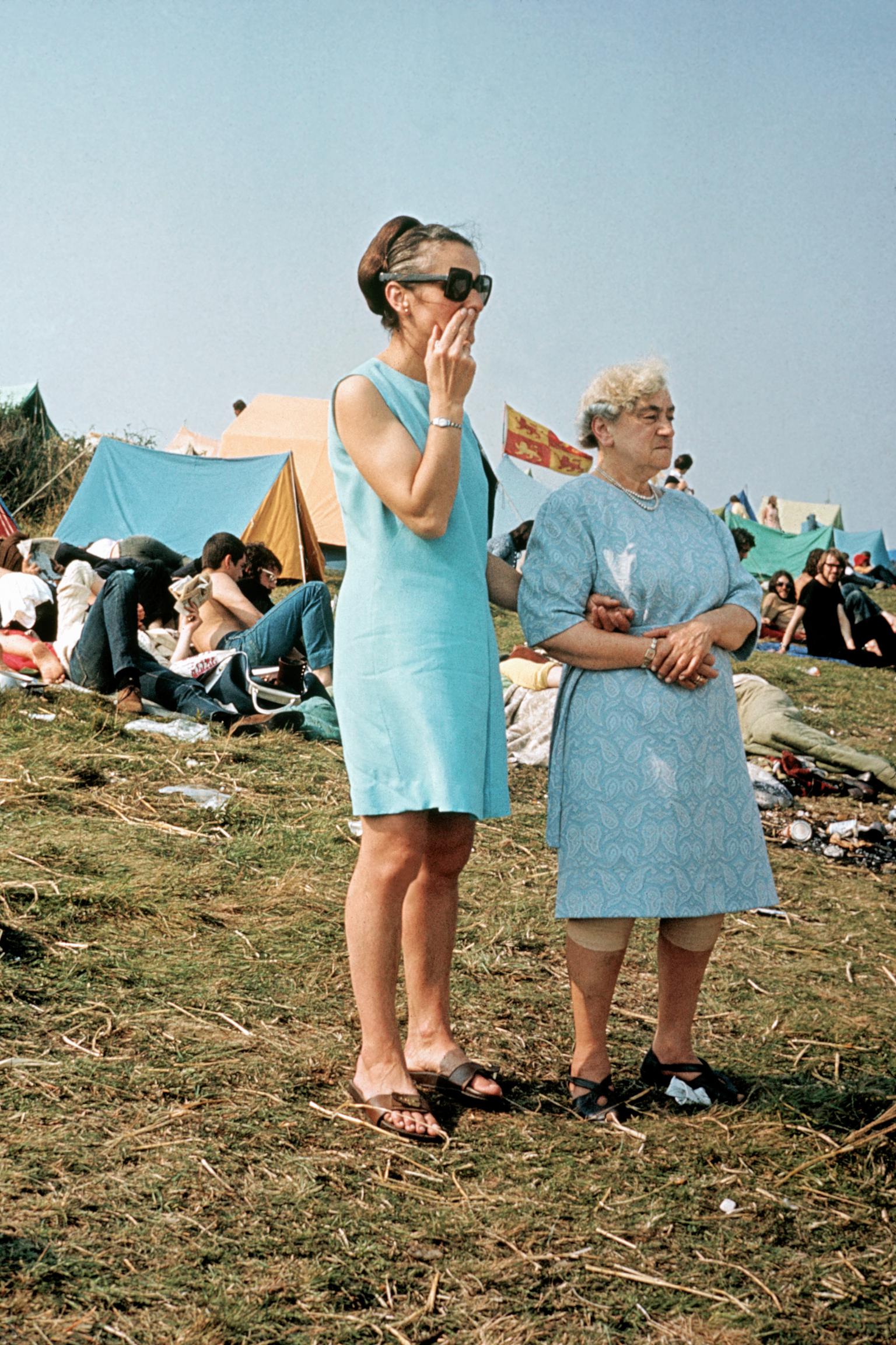 Isle of Wight Festival. Two Isle of Wight residents look out over the festival site