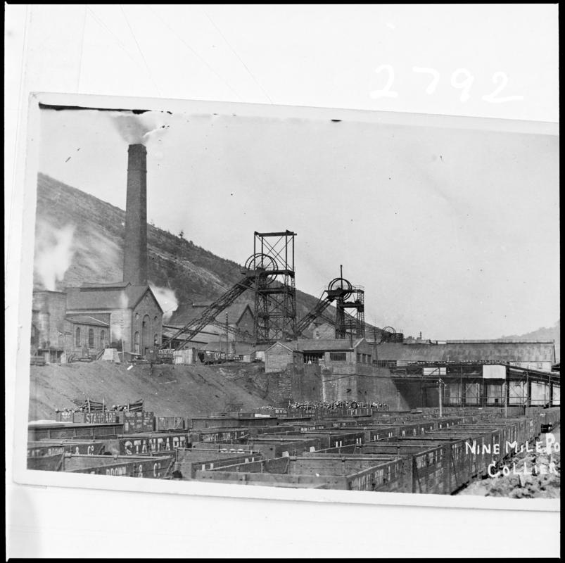 Black and white film negative of a photograph showing a surface view of Nine Mile Point Colliery, Cwmfelinfach. &#039;Nine Mile Point&#039; is transcribed from original negative bag.