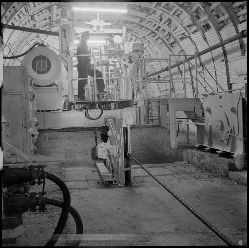 Black and white film negative showing a man operating a haulage engine underground at Cwmtillery Colliery.  &#039;Cwmtillery&#039; is transcribed from original negative bag.