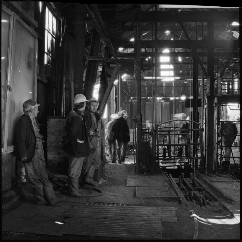 Black and white film negative showing men at pit top, Morlais Colliery 13 May 1981.  &#039;Morlais 13/5/81&#039; is transcribed from original negative bag.