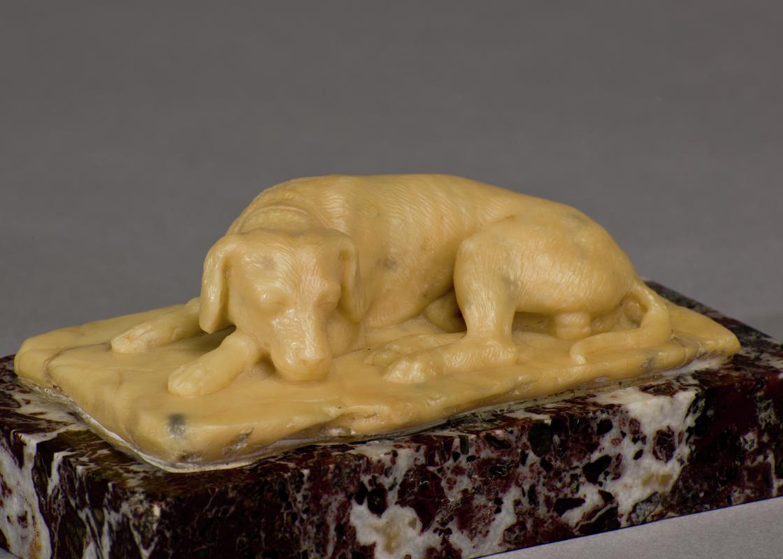 Small sculpture of a sleeping hound