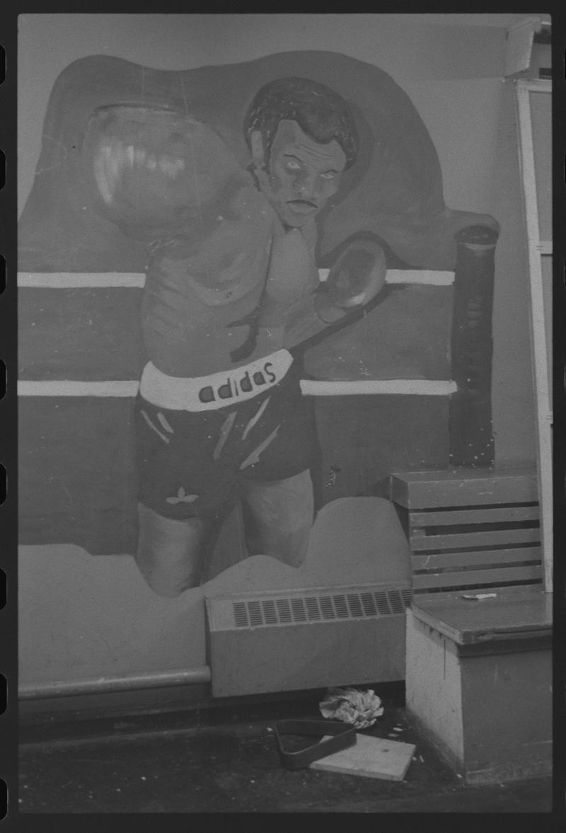 Poster of a boxer in Butetown Youth Club.