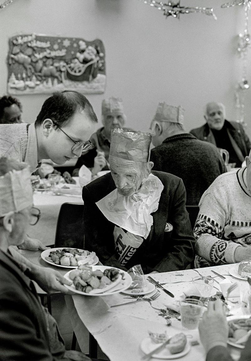GB. WALES. Cardiff. Bute Town - once known as &#039;Tiger Bay&#039;. Christmas Dinner at the Salvation Army Hostel, Bute Street. 1997