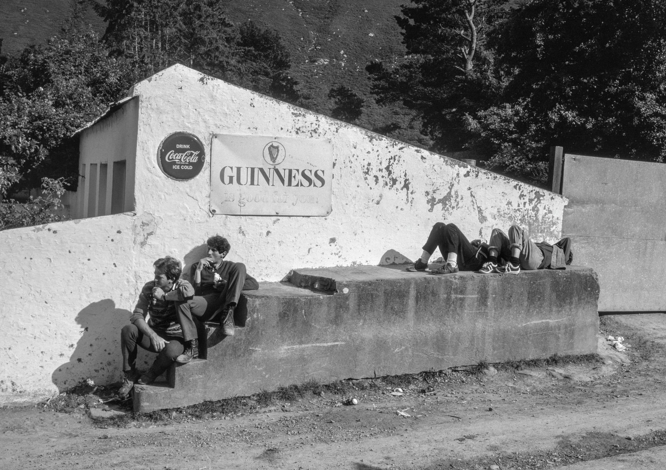 The Irish have the ability to relax in a most elegant way. You often see them, as here in Kerry, sitting by the roadside for no apparent reason. Kerry. Ireland