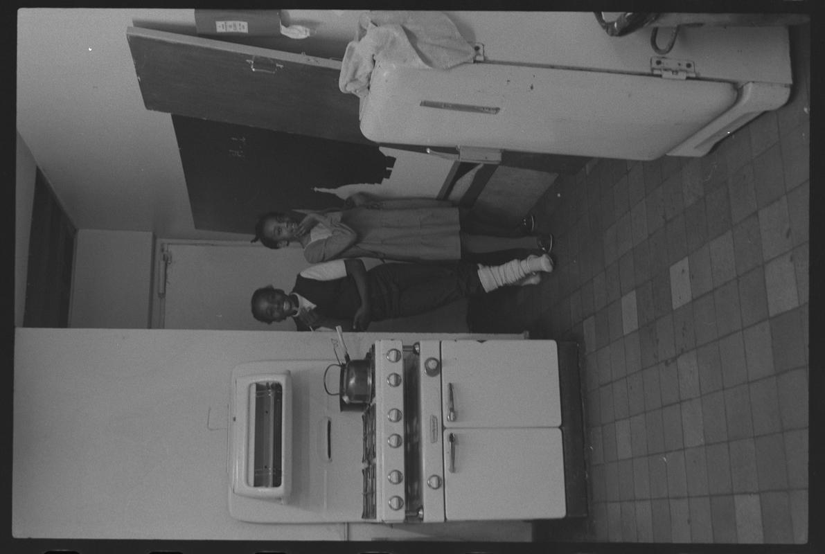 Two girls in kitchen of Butetown Youth Club.