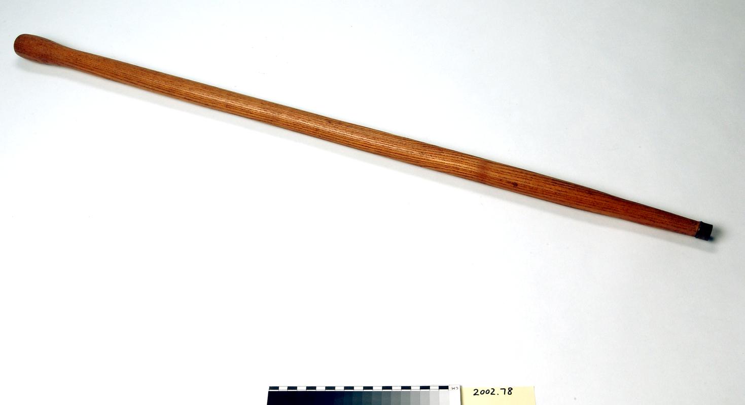 Wooden Deputy&#039;s yardstick with metal tip.