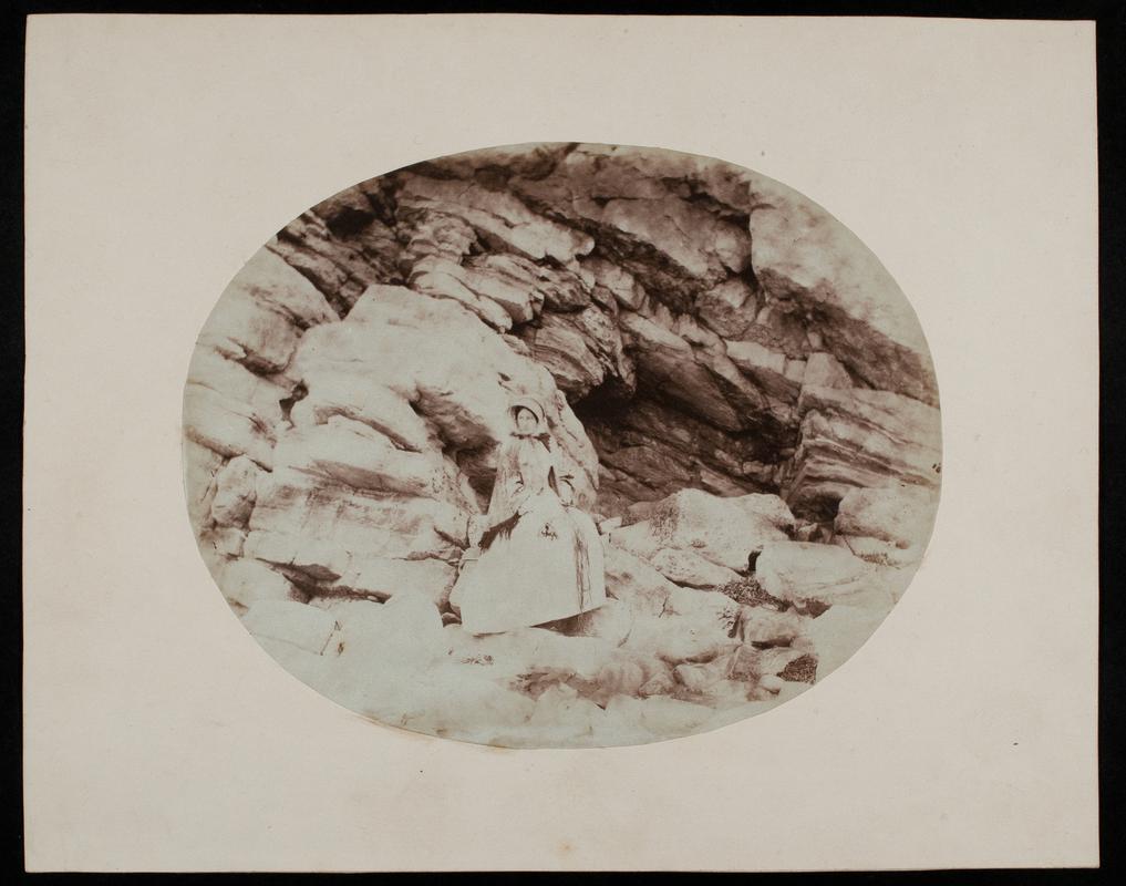 Thereza Llewelyn seated on rocks