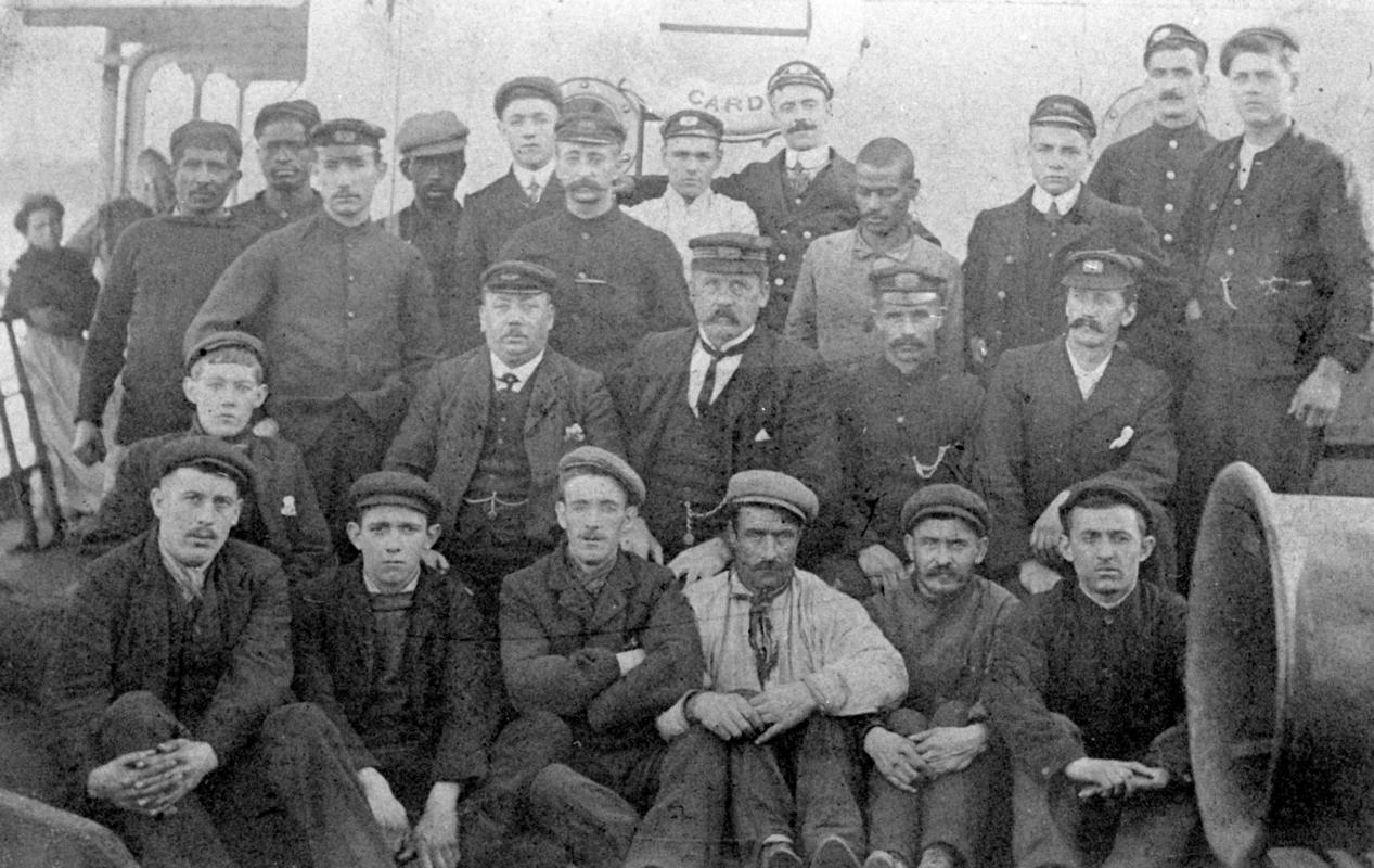 Crew of the ss ARVONIAN at an unknown Spanish port (cropped close up view)