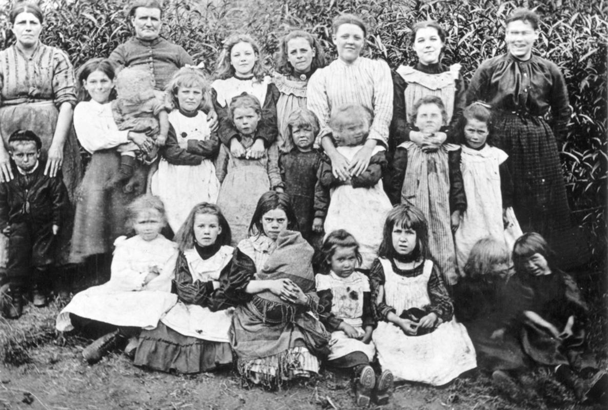 Group of women and children, former inhabitants of Rhyd-y-car, Merthyr Tydfil.