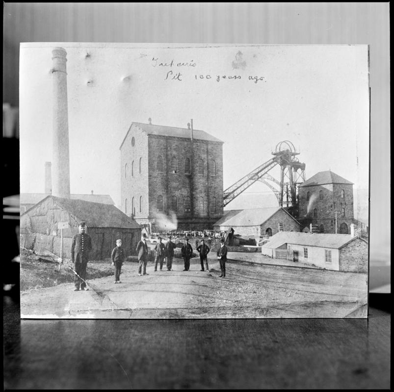 Black and white film negative of a photograph showing a general surface view of Deep Navigation Colliery, 1878.  The engine house housed the vertical winder.  The figure on the left is the colliery policeman.
