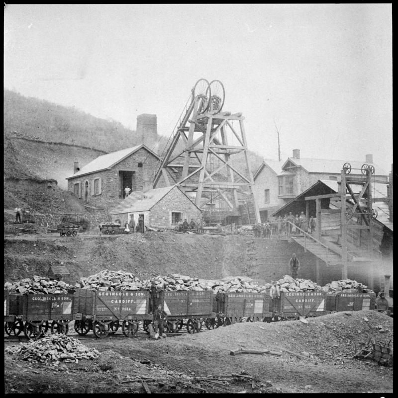 Film negative of a photograph showing a general surface view of Cymmer Colliery, 1860.  &#039;Cymmer&#039; is transcribed from original negative bag.