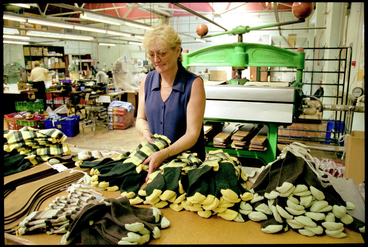 Diane Phillips sorting pairs of sized and washed socks prior to pressing and labelling at Corgi Hosiery Ltd factory, Ammanford, 1 July 2002.