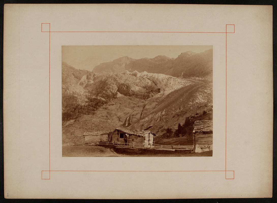 Mountain landscape, with glacier and timber cabins in foreground