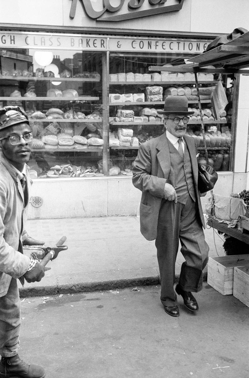 GB. ENGLAND. Soho street market. One of first pictures taken - using a Kodak Retina folding camera (first camera). 1955.