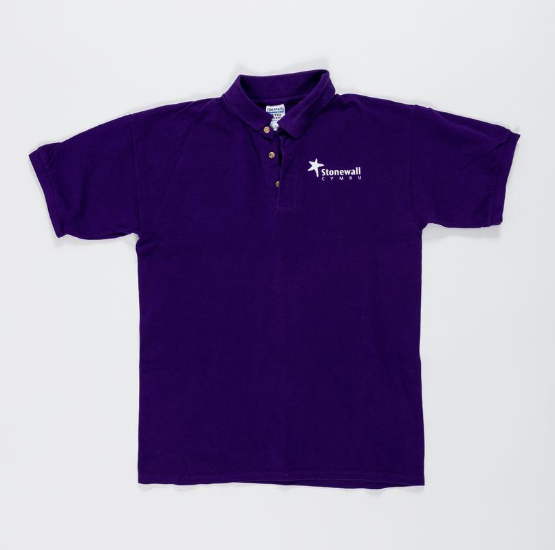 Dark purple t-shirt with &#039;Stonewall Cymru&#039; logo on the front.